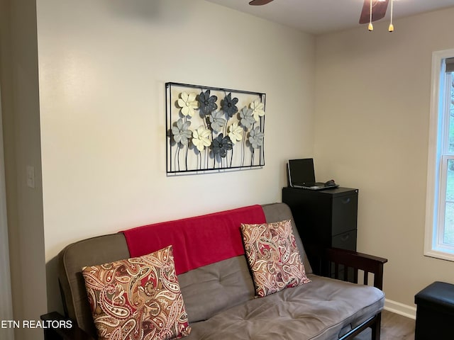 living room with hardwood / wood-style floors and ceiling fan