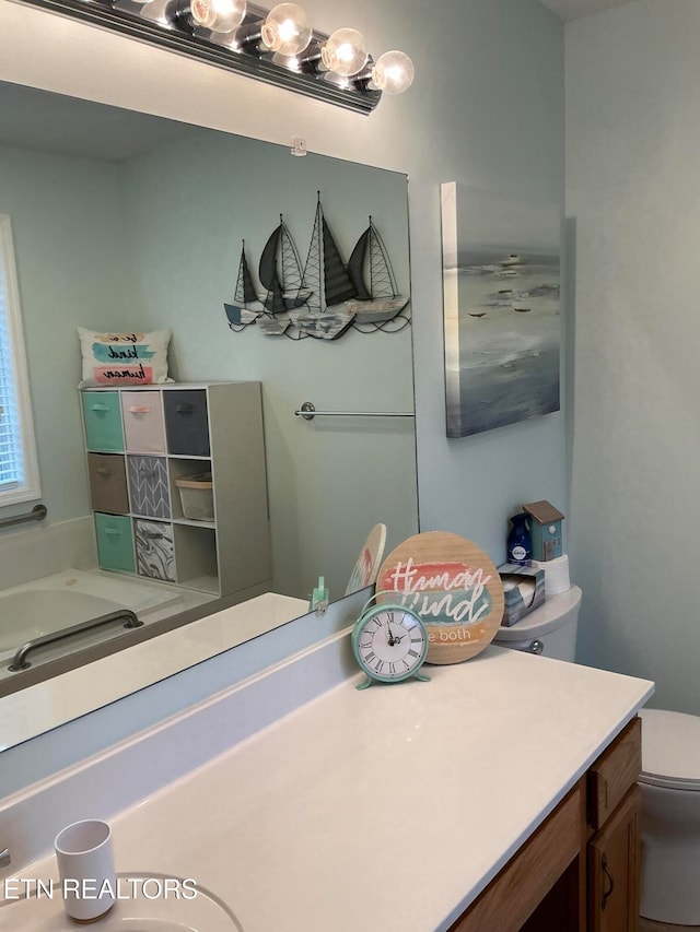 bathroom with vanity and toilet