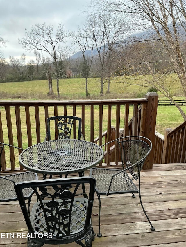 wooden deck with a yard