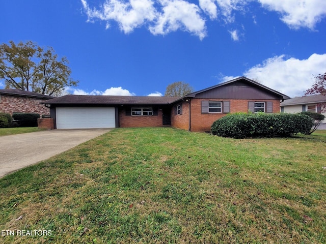 ranch-style home with a garage and a front yard