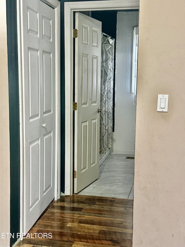 hallway featuring dark hardwood / wood-style floors