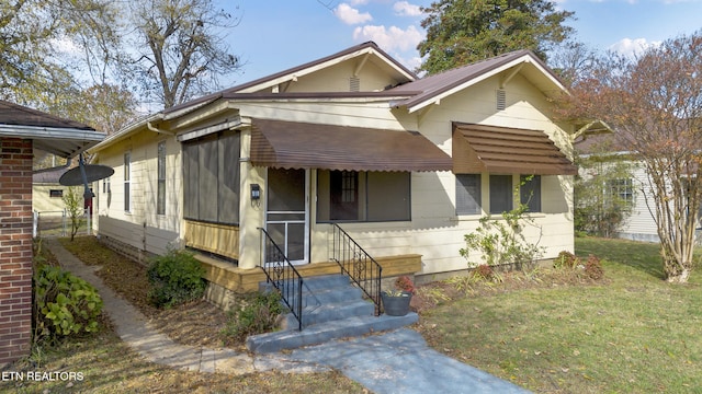 bungalow with a front yard