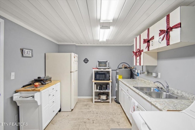 kitchen featuring black microwave, sink, white refrigerator, wooden ceiling, and washer / dryer