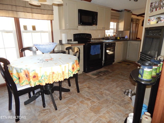 dining space with a healthy amount of sunlight and sink