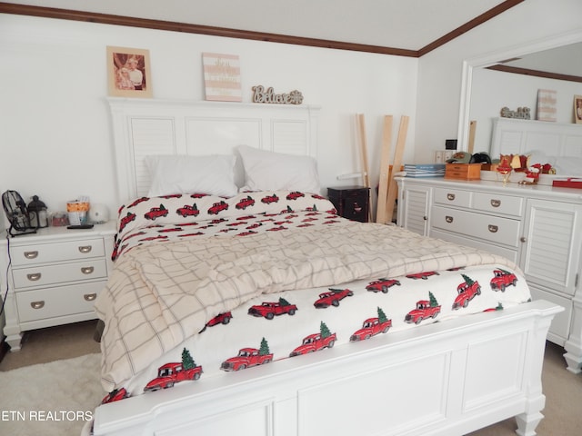 carpeted bedroom with ornamental molding