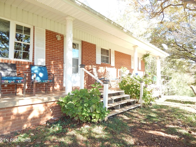 doorway to property with covered porch