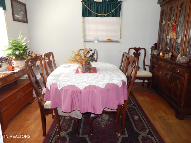 dining area with light hardwood / wood-style floors