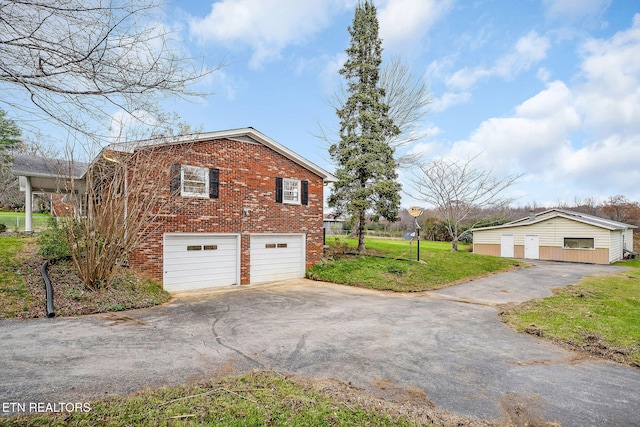 view of property exterior with a lawn and a garage