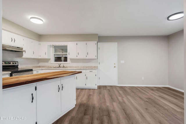 kitchen with white cabinets, light wood-type flooring, stainless steel electric range oven, and sink