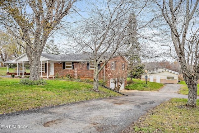 view of front facade with a garage and a front lawn