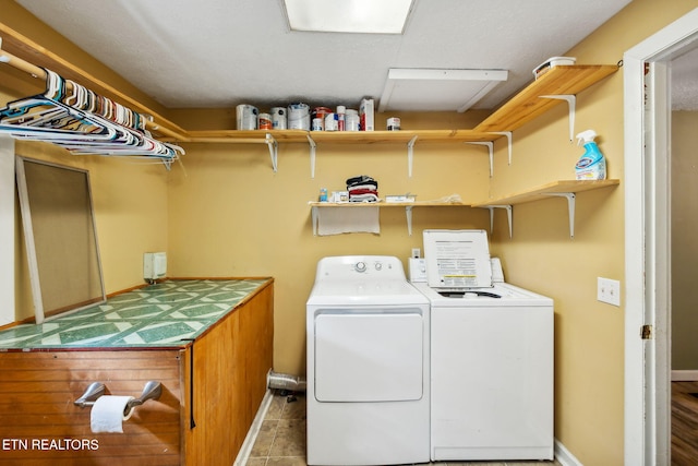 laundry area with independent washer and dryer