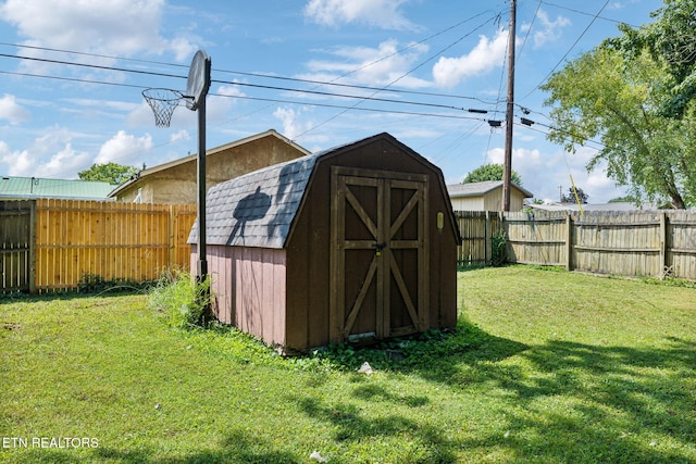 view of outdoor structure featuring a lawn