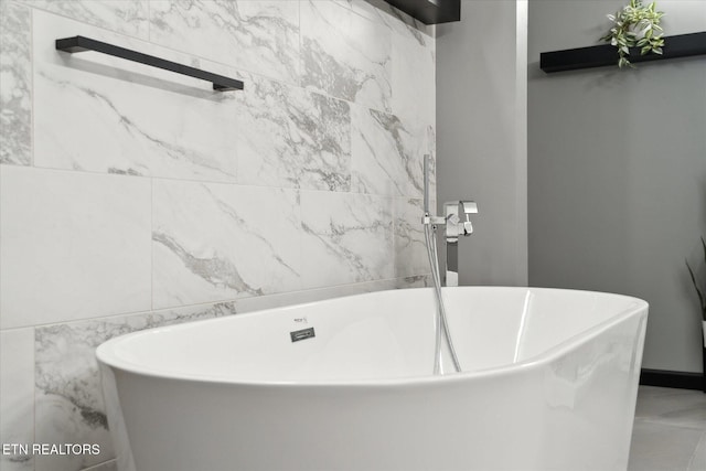 bathroom with a tub to relax in