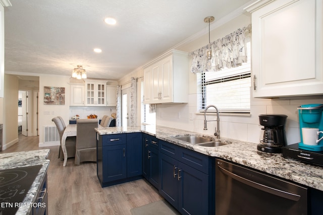 kitchen with white cabinets, blue cabinets, sink, light hardwood / wood-style flooring, and stainless steel appliances