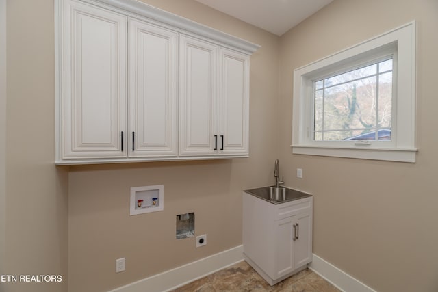 washroom with sink, hookup for a washing machine, cabinets, and hookup for an electric dryer