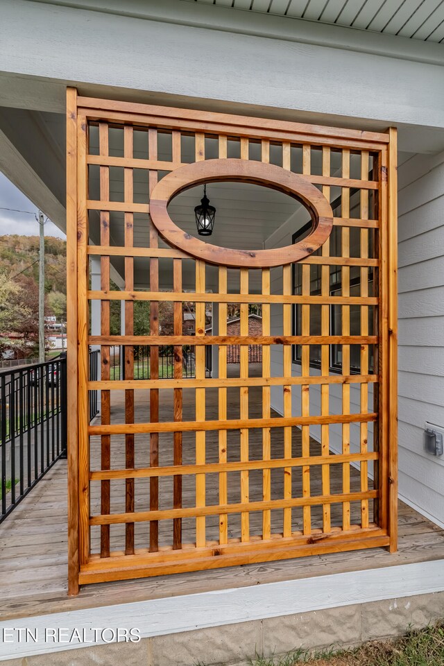 wine cellar with hardwood / wood-style floors and wood walls