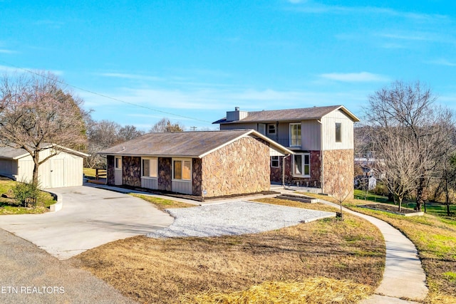 front of property with an outdoor structure