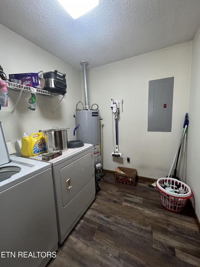 washroom with electric panel, dark wood-type flooring, washer and dryer, and gas water heater