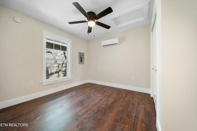 spare room featuring dark hardwood / wood-style floors, ceiling fan, electric panel, and a wall mounted AC