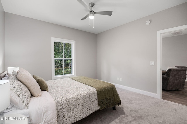 carpeted bedroom with ceiling fan