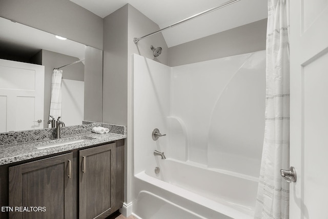 bathroom with vanity and shower / bath combo