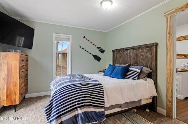 bedroom featuring crown molding and carpet