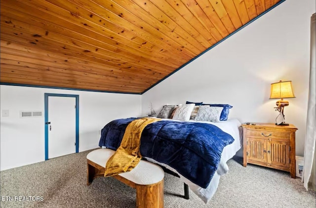 carpeted bedroom featuring lofted ceiling and wood ceiling