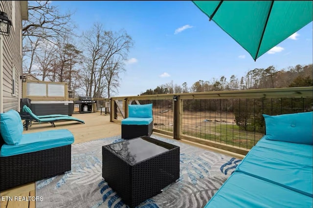 view of patio / terrace with outdoor lounge area, area for grilling, and a deck