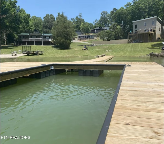 1448 Dover Ln, Dandridge, TN 37725 - dock featuring a lawn and view of wooded area