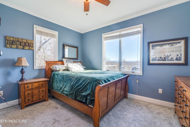 bedroom with light carpet, ceiling fan, and crown molding