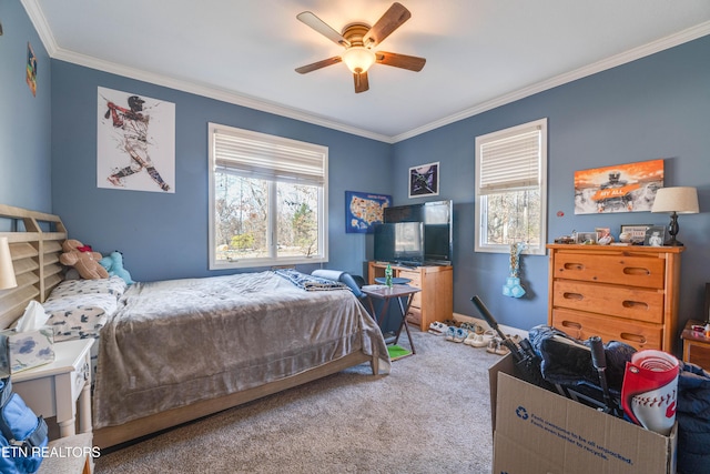 carpeted bedroom with ceiling fan and crown molding