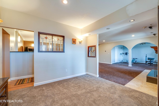 carpeted empty room with ornamental molding