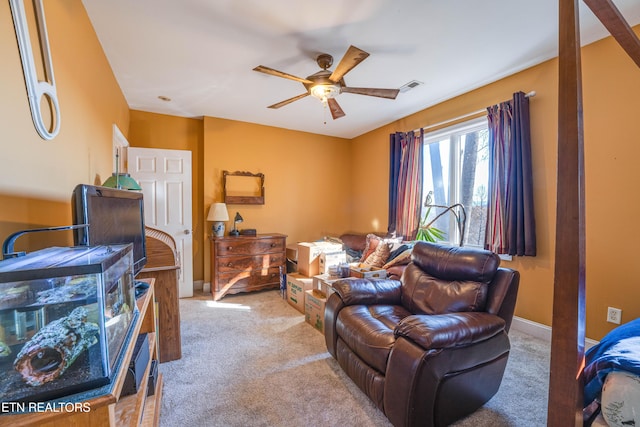 living room featuring ceiling fan and light carpet