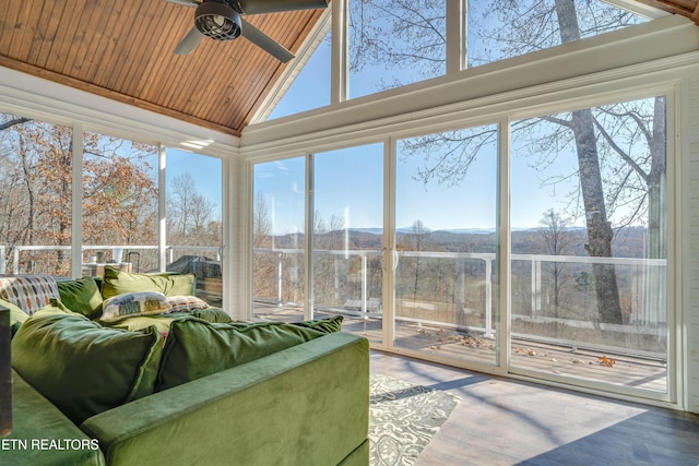 sunroom featuring ceiling fan, a healthy amount of sunlight, lofted ceiling, and wooden ceiling