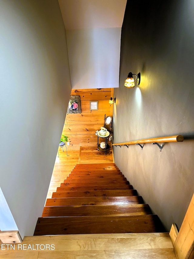 staircase featuring hardwood / wood-style floors