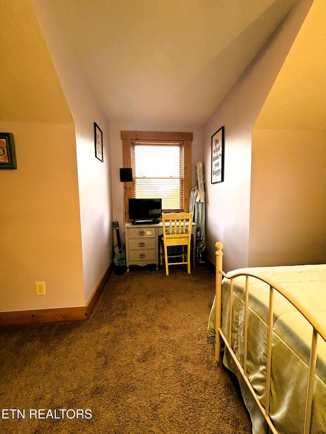 carpeted bedroom featuring vaulted ceiling