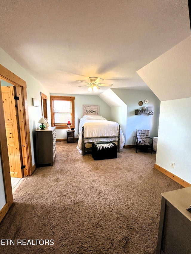 bedroom featuring carpet, ceiling fan, lofted ceiling, and a textured ceiling