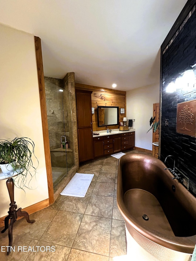 bathroom with tile patterned flooring, vanity, and independent shower and bath