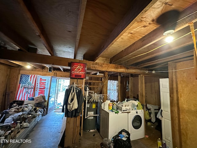 interior space with washing machine and dryer, a wealth of natural light, and water heater