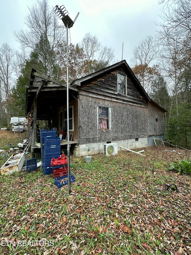 view of home's exterior with ac unit