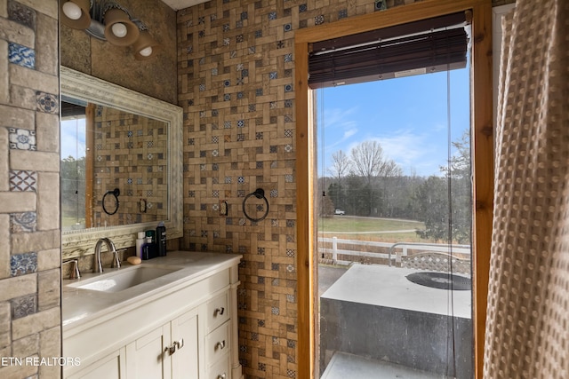 bathroom with plenty of natural light and vanity