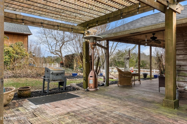 view of patio / terrace featuring outdoor dining area, fence, a ceiling fan, grilling area, and a pergola