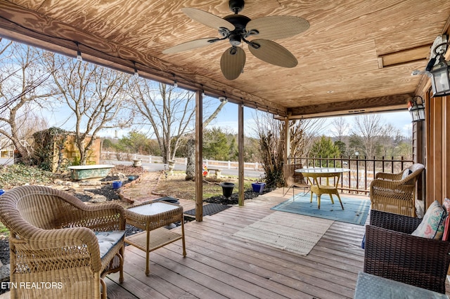 deck featuring outdoor dining space and ceiling fan