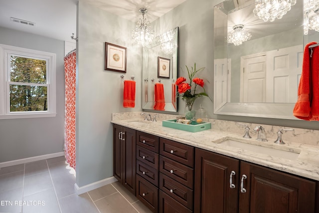 bathroom featuring tile patterned floors, curtained shower, vanity, and a notable chandelier