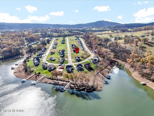 bird's eye view featuring a water and mountain view