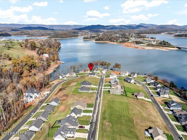 bird's eye view with a water and mountain view