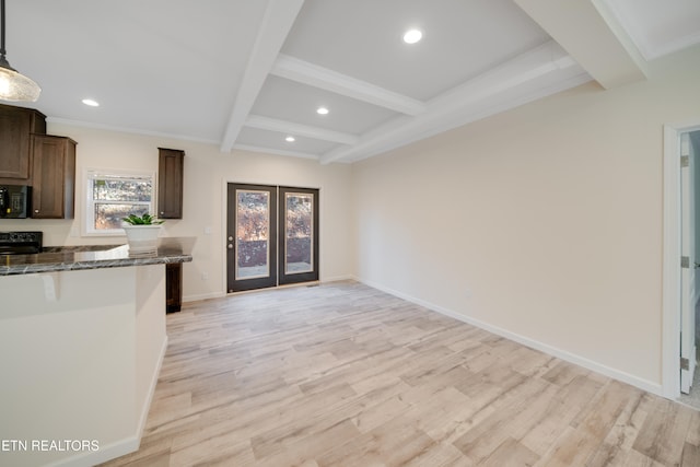 kitchen with beamed ceiling, hanging light fixtures, light hardwood / wood-style floors, and black appliances