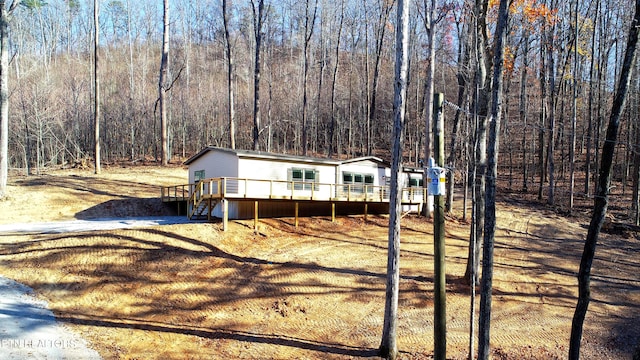 view of front of house with a wooden deck