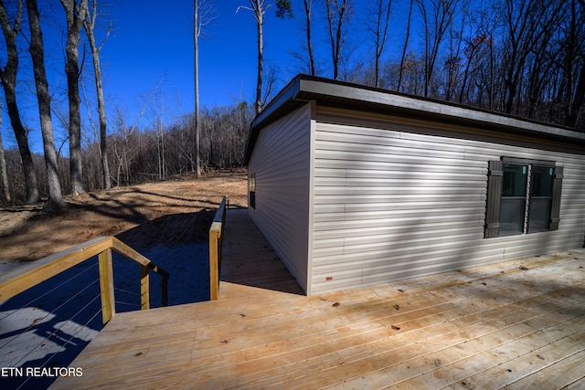 view of property exterior featuring a deck