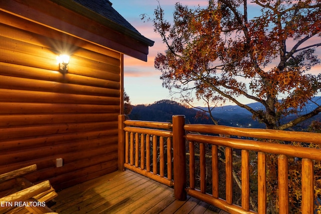 deck at dusk with a mountain view